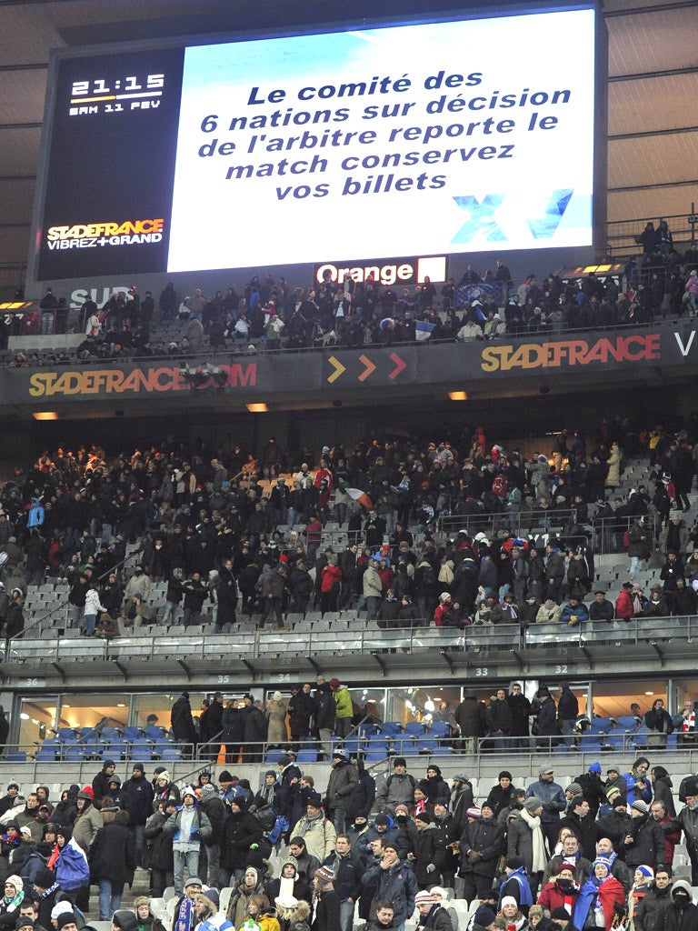 The information board reads: ‘The Six Nations committee will reschedule the match, keep your tickets’ at the Stade de France on Saturday