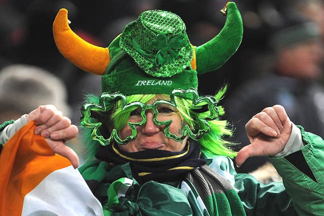 An Irish fan gives the thumbs down after the France-Ireland match was postponed just before kick-off on Saturday at the Stade de France