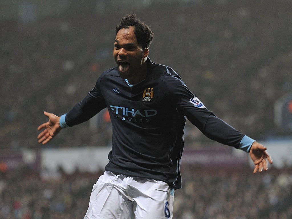 Joleon Lescott celebrates after scoring the only - and winning - goal for Manchester City against Aston Villa