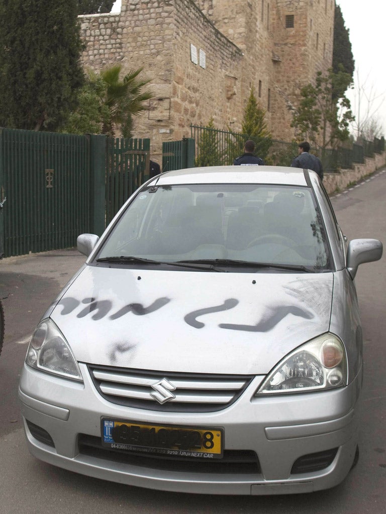 Vandals sprayed the words “price tag” on a car