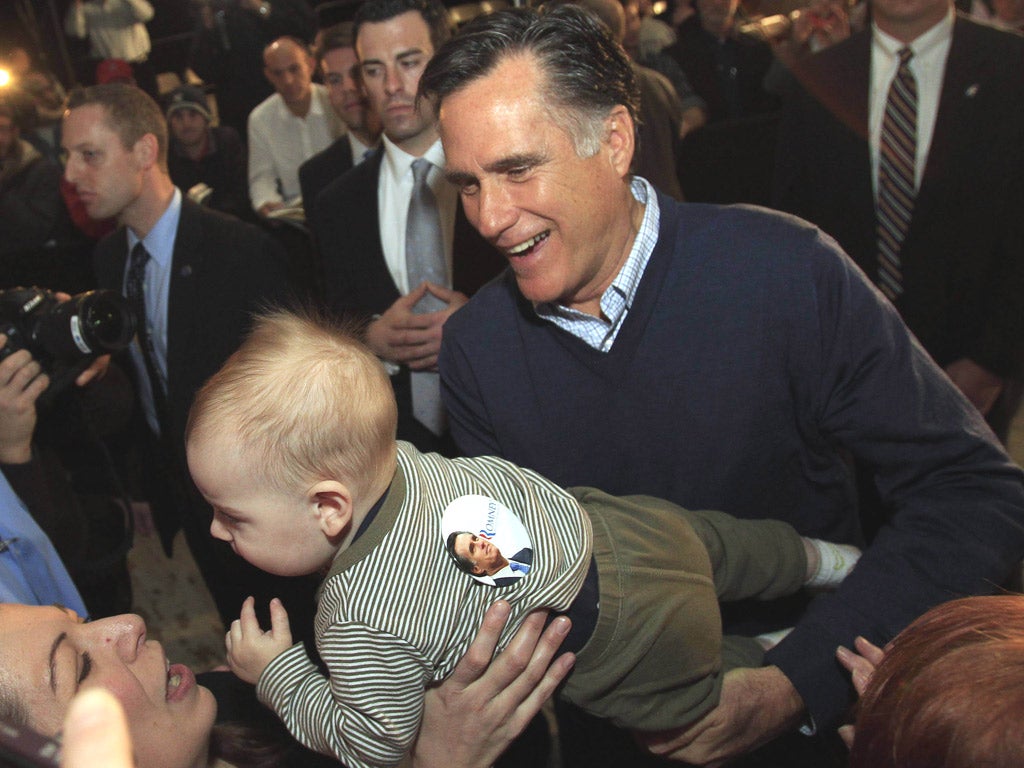 Mitt Romney, the Republican frontrunner, meets his supporters during a campaign stop in Portland, Maine