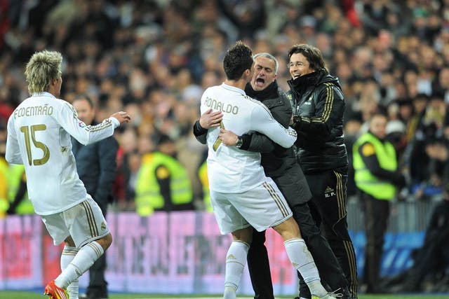 Ronaldo, who scored a hat-trick, celebrates with Mourinho