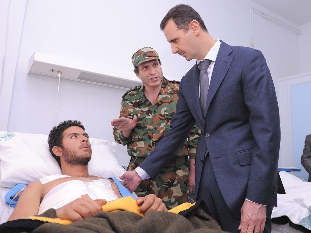 President Bashar al-Assad visiting wounded soldiers in hospital