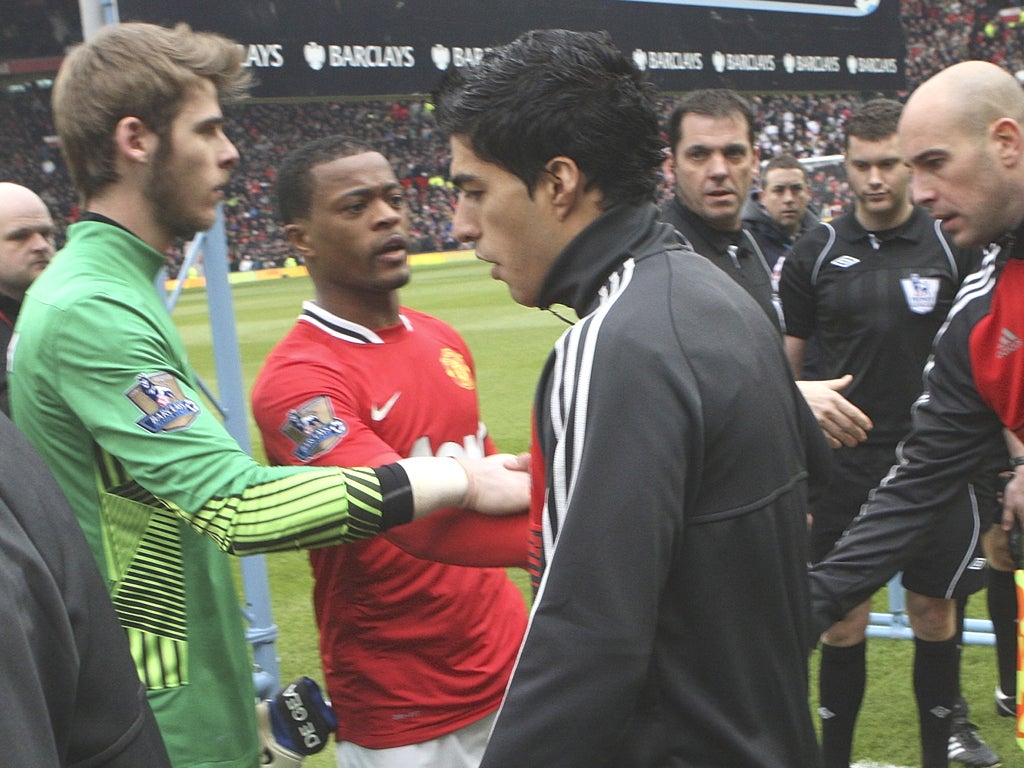 Liverpool's Luis Suarez refuses to shake Patrice Evra’s hand back in February 2012