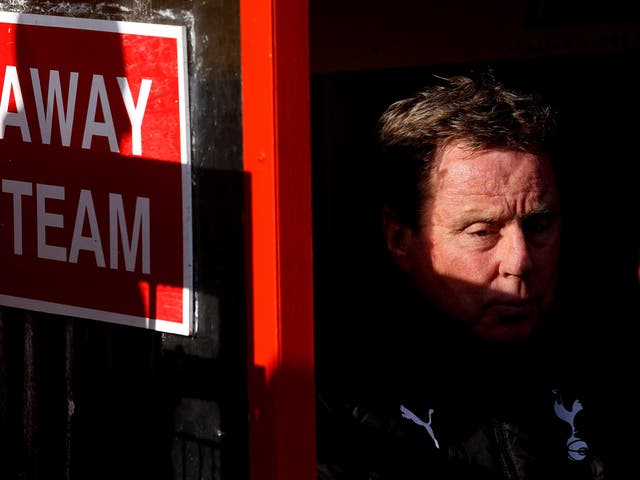 Tottenham Hotspur manager Harry Redknapp sits in the away dug-out