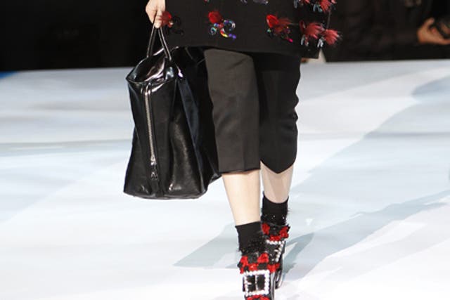 Marc Jacobs: The shoes looked Pilgrimesque, apart from the rhinestone buckle and flowers; the calf-length skirts and A-line wool coats matronly were it not for psychedelic print. The construction of each ensemble was a triumph of the imagination at Marc Jacobs. Contained within the collection – leather and lace, print and sparkle, cropped, long and oversized.