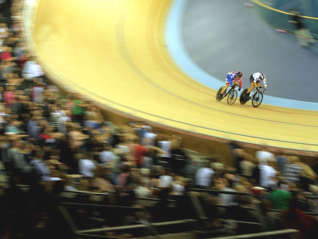 Great Britain’s Sir Chris Hoy (left) races Germany’s Max Levy in the men’s sprint final