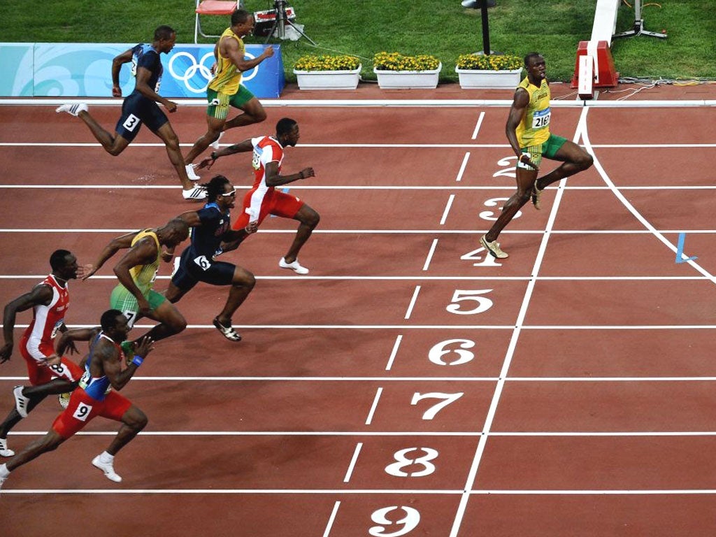 Front-runner: Jamaica’s Usain Bolt storms over the finish line to win the men’s 100-metre final at the 2008 Beijing Olympic Games