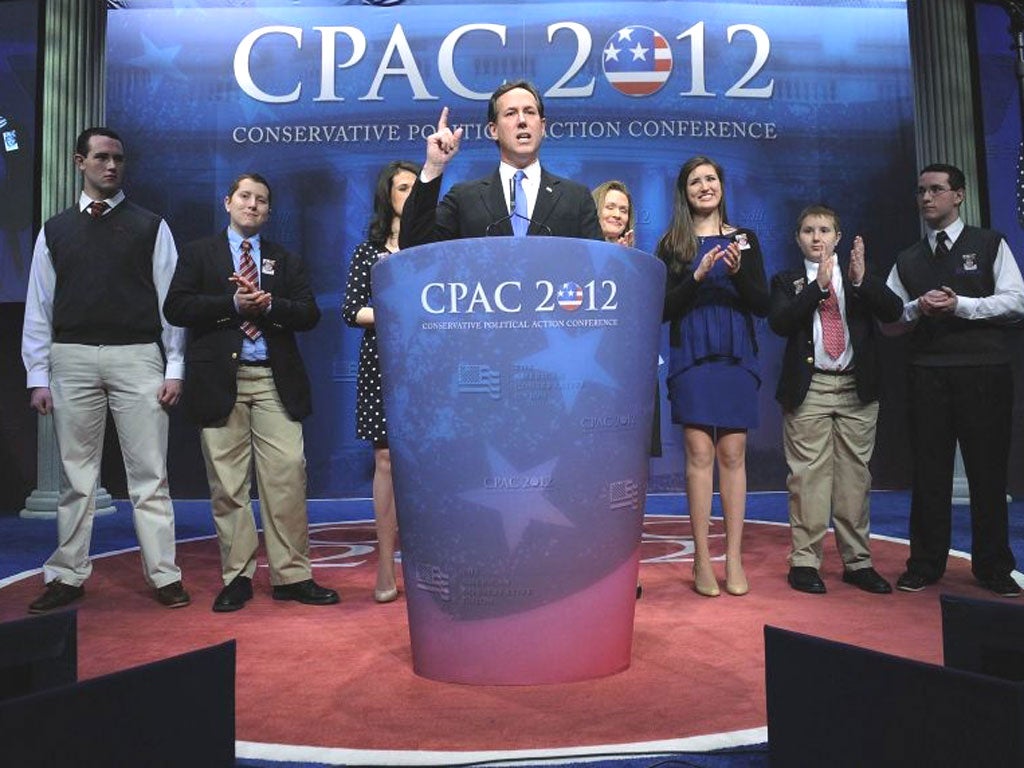 Rick Santorum is flanked by his family at a speech in Washington. His seven children are home-schooled