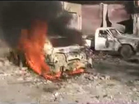 A car burning after shelling in the Baba Amro neighbourhood