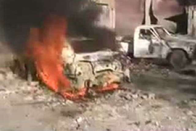 A car burning after shelling in the Baba Amro neighbourhood