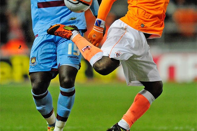 Blackpool's Lomana LuaLua shows his tricks to Abdoulaye Faye