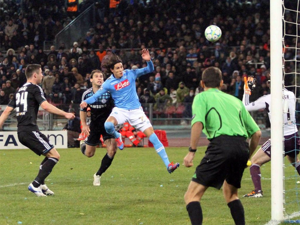 Napoli's Uruguayan forward Edinson Cavani puts the hosts ahead with a goal which went in off his shoulder