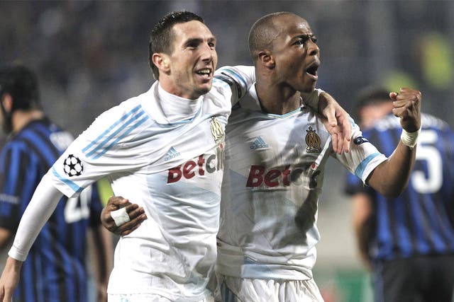 Marseille's Andre Ayew, right, celebrates his goal with Morgan Amalfitano
