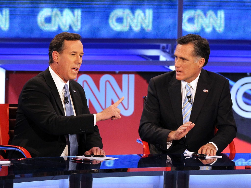 Rick Santorum (left) and Mitt Romney at last night's debate