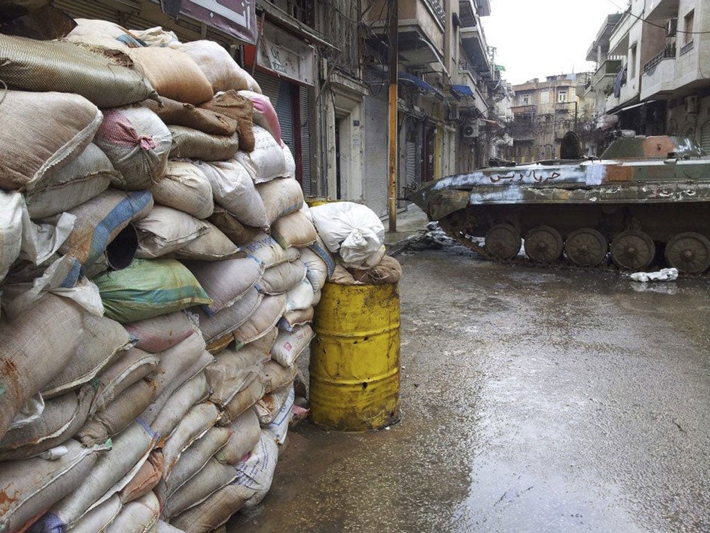 A damaged tank in the Bab Sabaa neighbourhood of Homs