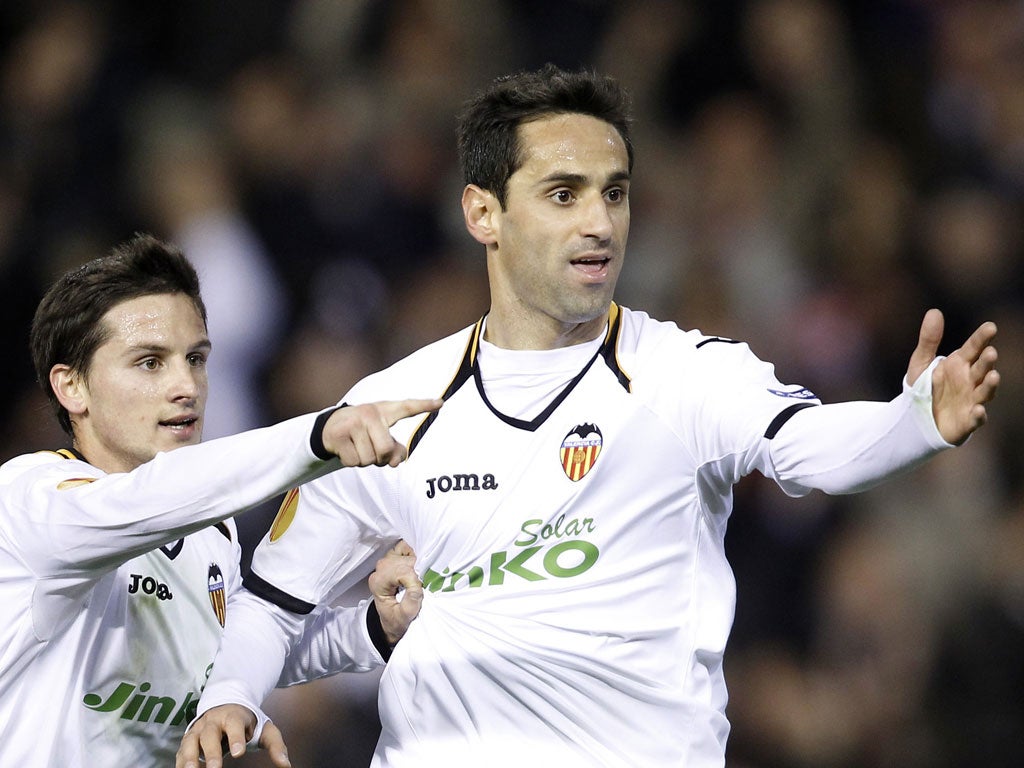 Valencia's Jonas, right, celebrates after scoring against Stoke City