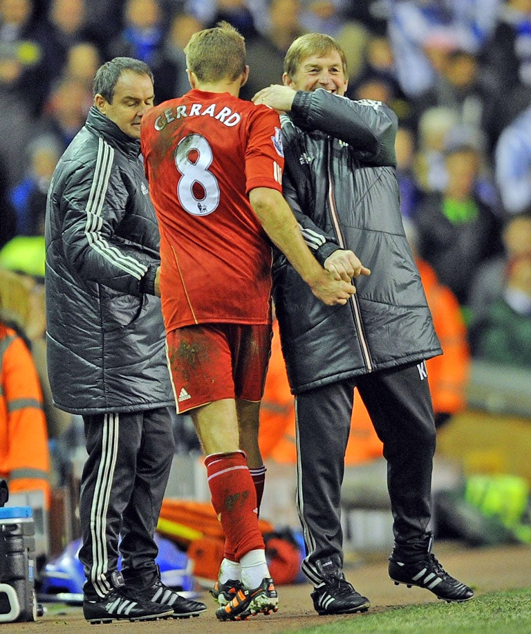 Kenny Dalglish is all smiles with his captain Steven Gerrard