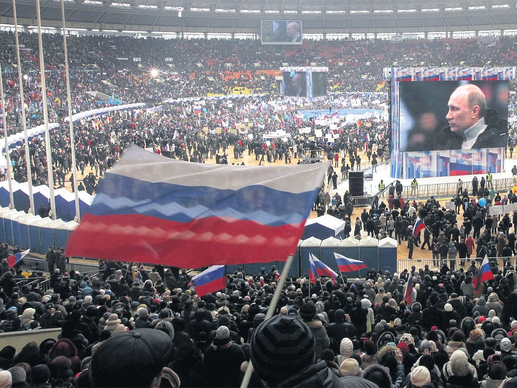 Supporters fill the Luzhniki stadium on Defender of the Fatherland Day in Moscow at a rally for Prime Minister 
Vladimir Putin. Russia will go to the polls for a presidential election on 4 March