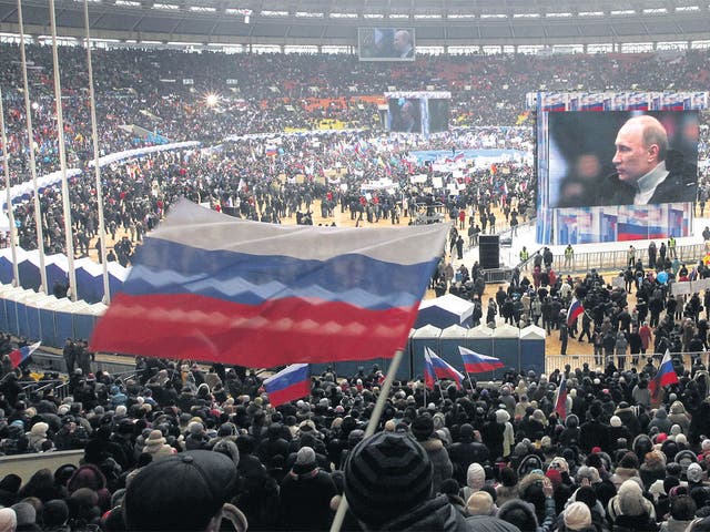 Supporters fill the Luzhniki stadium on Defender of the Fatherland Day in Moscow at a rally for Prime Minister 
Vladimir Putin. Russia will go to the polls for a presidential election on 4 March