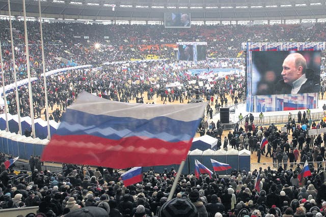 Supporters fill the Luzhniki stadium on Defender of the Fatherland Day in Moscow at a rally for Prime Minister 
Vladimir Putin. Russia will go to the polls for a presidential election on 4 March