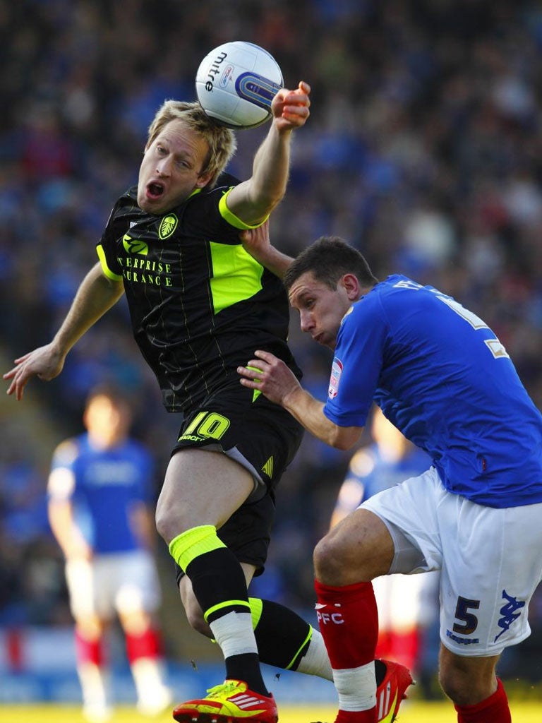 Leeds' Luciano Becchio (left) tangles with Jason Pearce