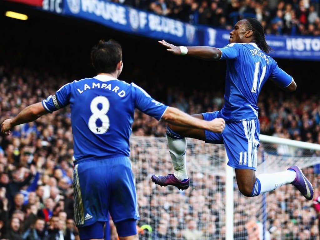 Didier Drogba celebrates with captain Frank Lampard