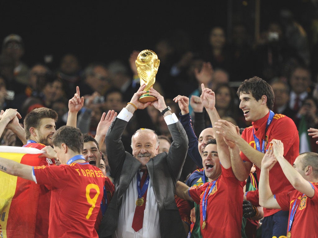 Vicente del Bosque lifting the World Cup with Spain after the victory over the Netherlands