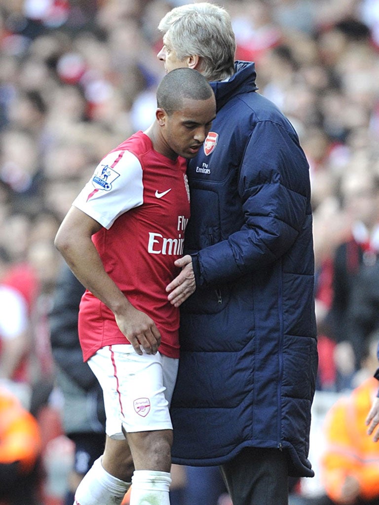 Theo Walcott is congratulated by his manager Arsène Wenger after yesterday’s remarkable victory