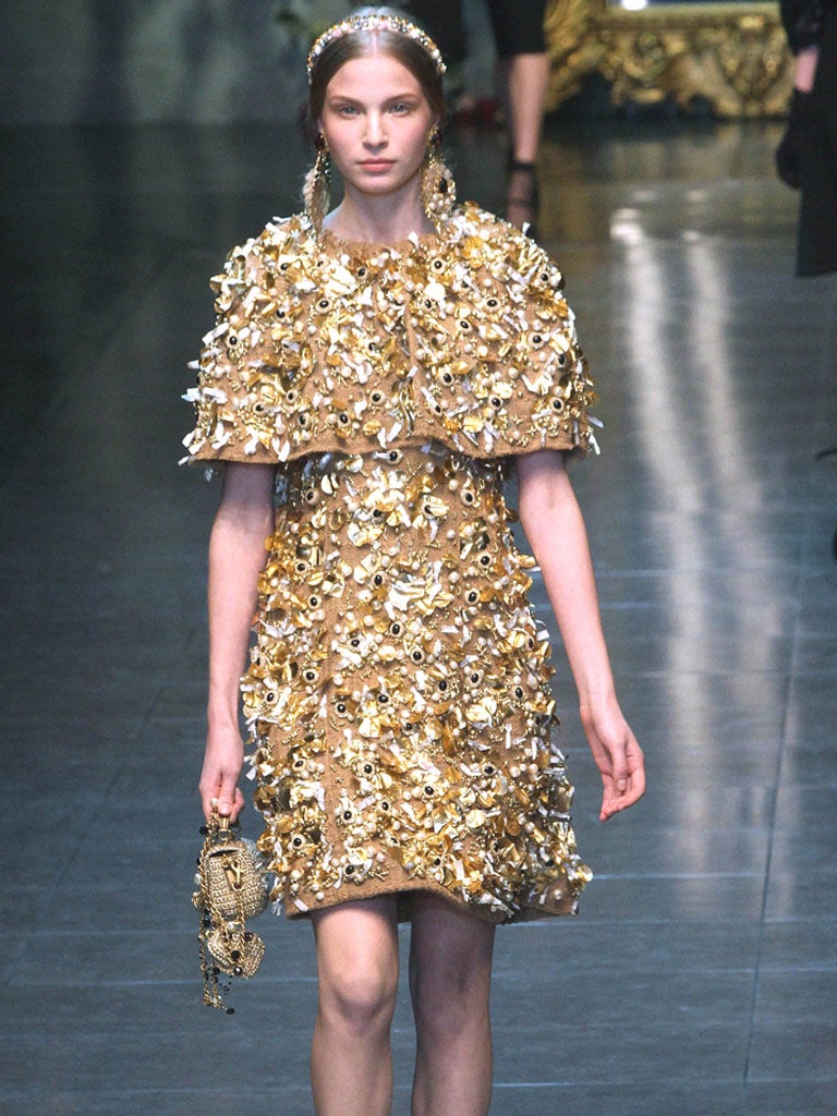 Severe but sumptuous: the Autumn/Winter collection featured black lace and wool, and accents picked out in
golden thread and beads