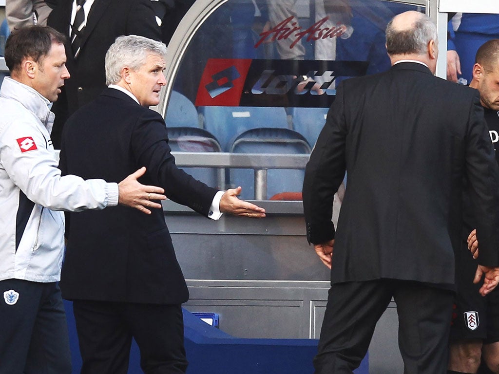 The Welshman is led away by a QPR coach