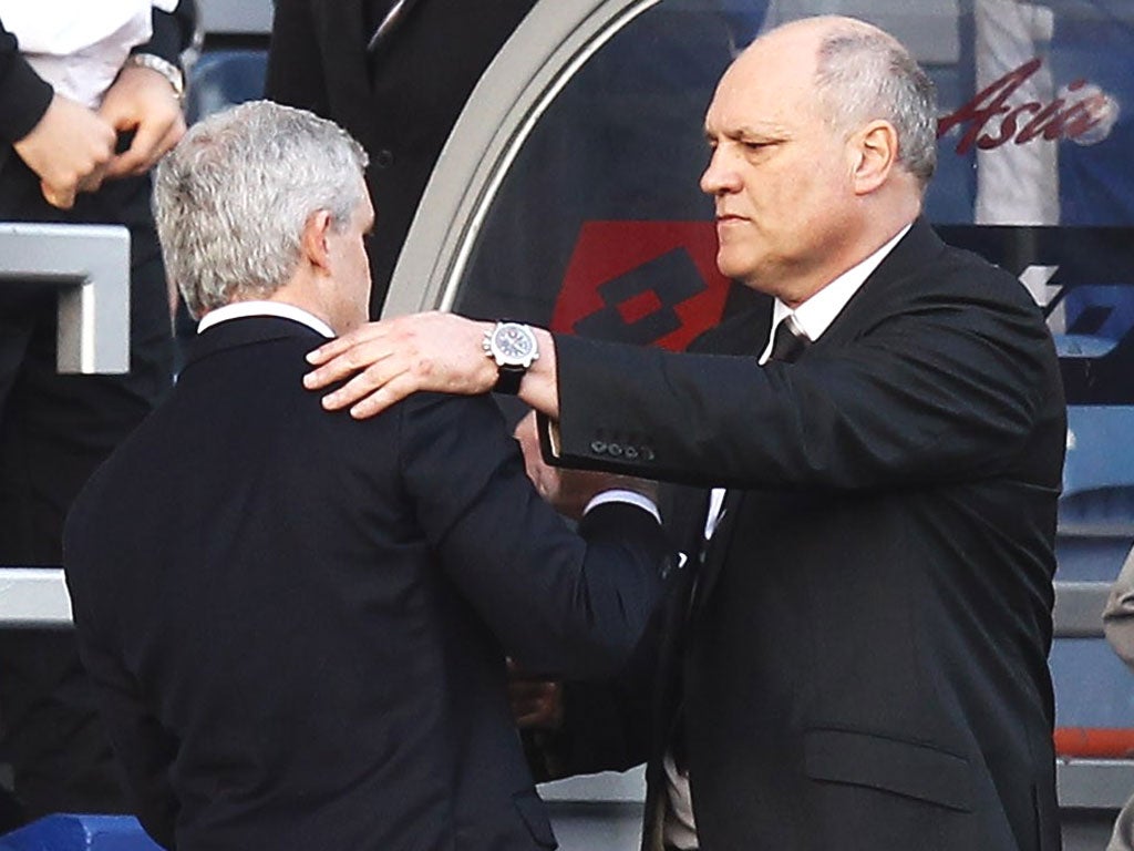 Dutchman Martin Jol attempted to pat Hughes on the side of the head