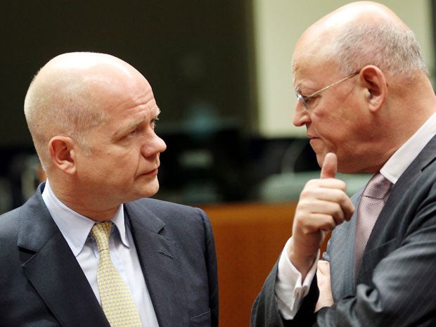 European foreign ministers, including Foreign Secretary William Hague and Dutch Minister of Foreign Affairs Uri Rosenthal (right), increased the pressure on Assad by freezing the assets of several Syrian government officials