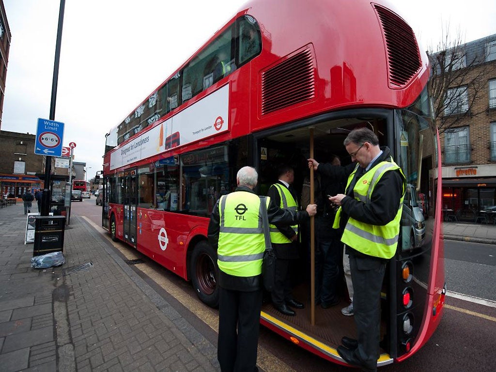 TfL staff keep a close eye on the new Routemaster's first day in service