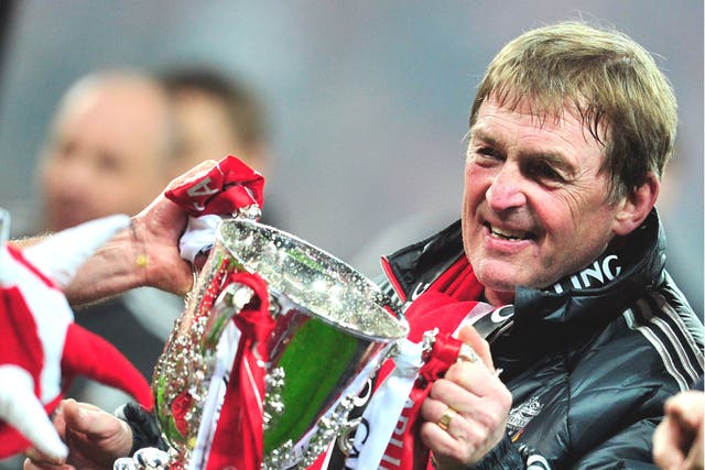 Kenny Dalglish grasps the Carling Cup, Liverpool’s first
trophy in six years