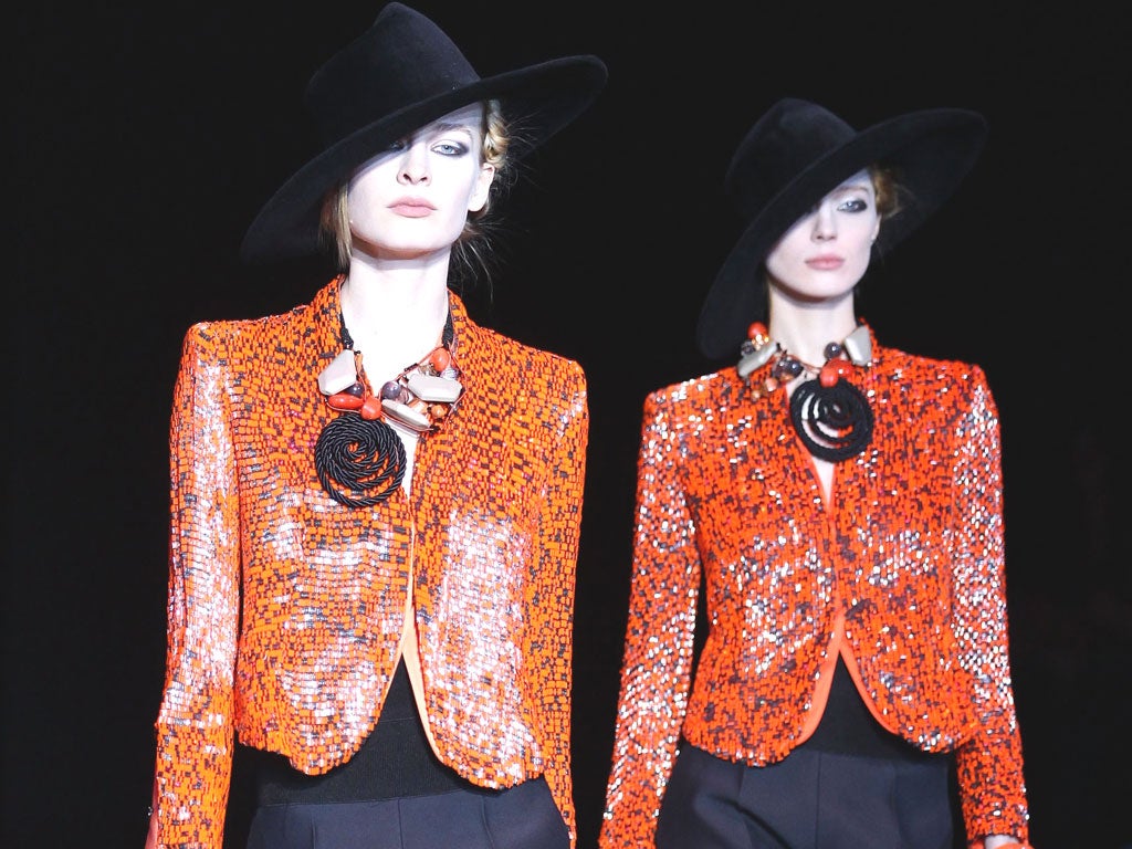 Models displaying Giorgio Armani jackets and jewellery
