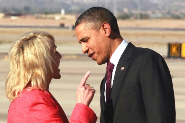Governor Jan Brewer holds an intense conversation with Barack Obama at Arizona’s Phoenix-Mesa Gateway Airport last month