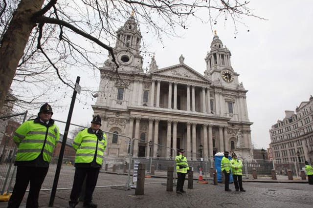 Police stand guard in front of St Paul's Cathedral