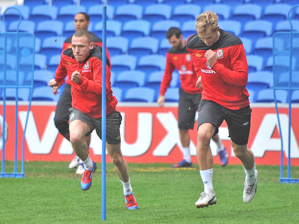 Craig Bellamy and West Ham's Jack Collison (right) during a Wales training session at the Millennium Stadium