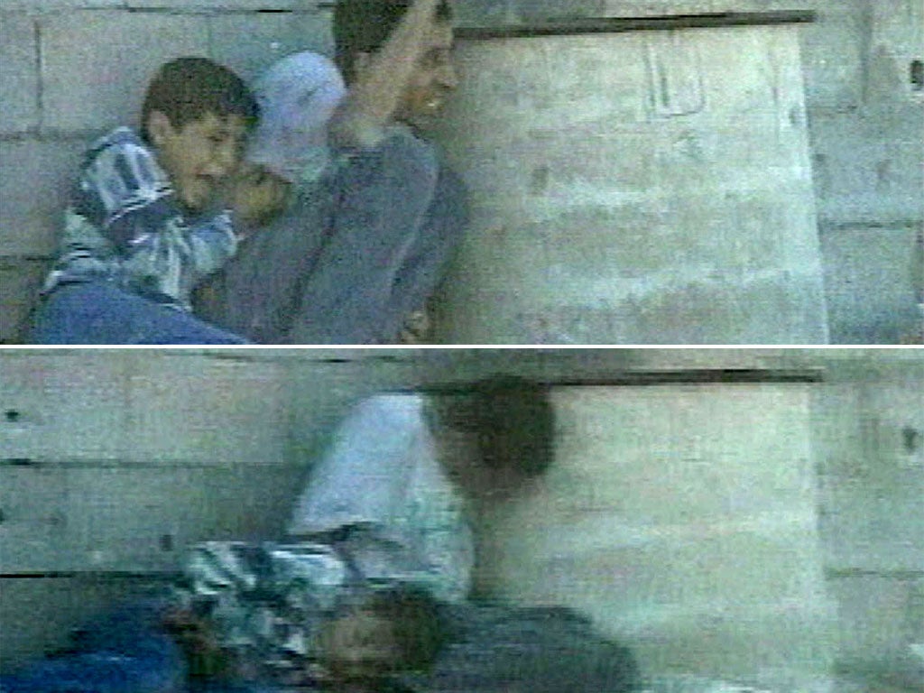 Above: Jamal al-Dura and his son Mohammed shelter from crossfire behind a barrel. Below: Mohammed lays in his father's lap after being fatally injured
