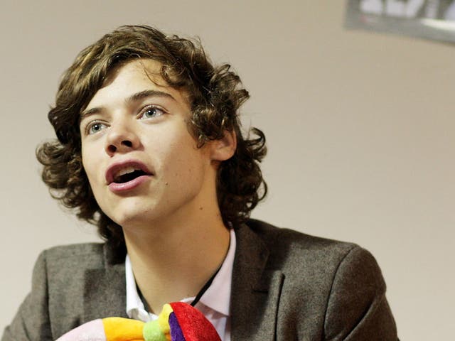 Showbiz journalist Caroline Whitmore has settled her libel case over a newspaper story linking her to young pop star Harry Styles (pictured)