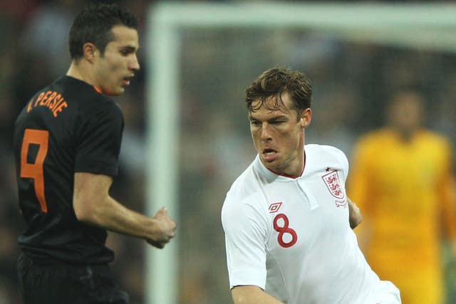 England captain Scott Parker eases past Robin van Persie