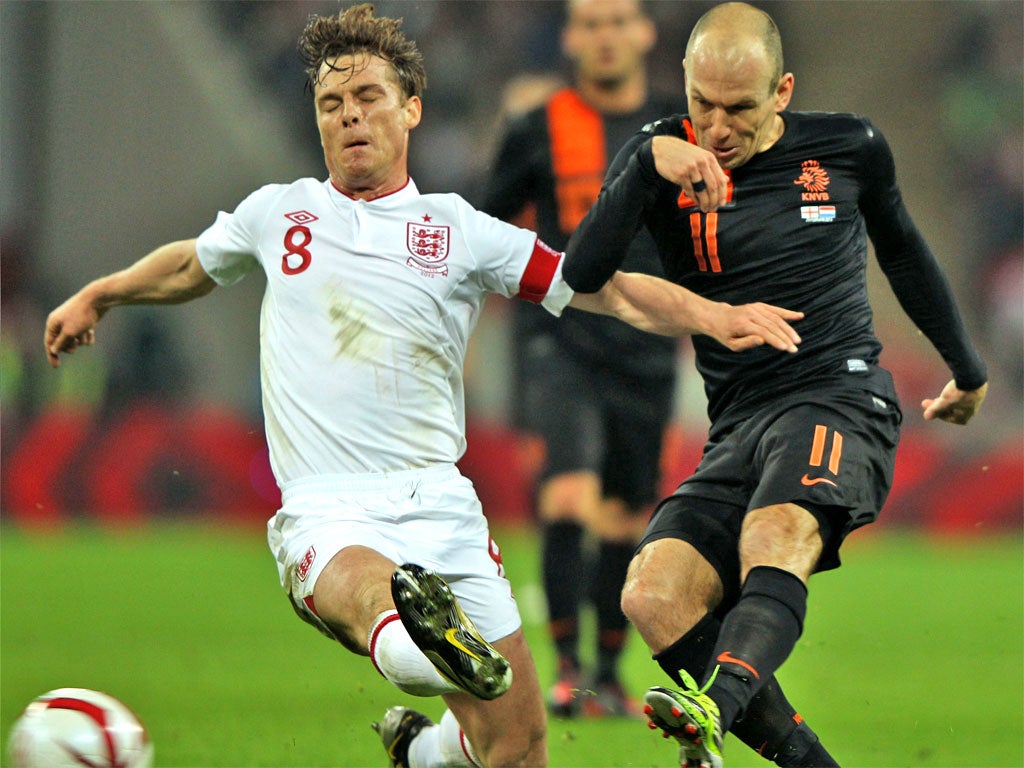 England captain Scott Parker battles for the ball with Arjen Robben