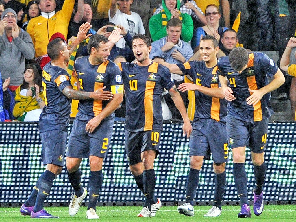 Harry Kewell is congratulated by team-mates after scoring Australia's second goal in Melbourne