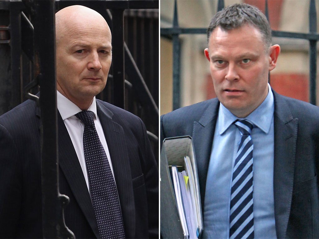 Det Chief Supt Philip Williams, left, and Det Chief Supt Keith Surtees leave the Leveson Inquiry in London yesterday