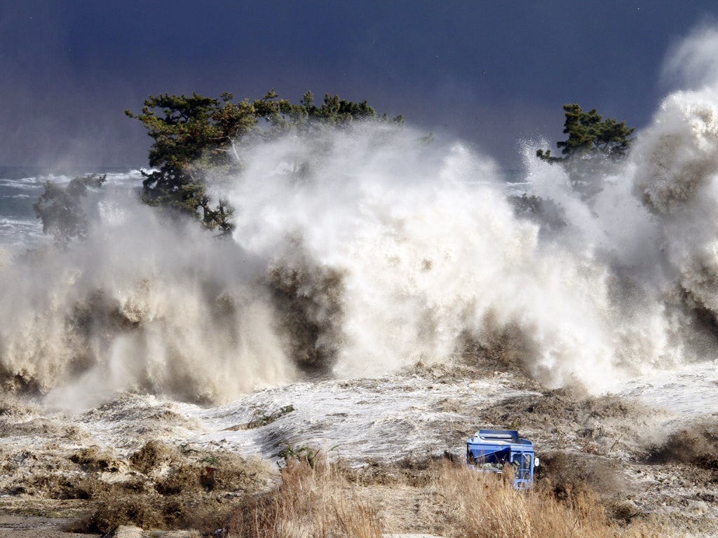 Tsunami waves as high as the trees hitting the coast of Minamisoma in Fukushima prefecture on 11 March 2011.