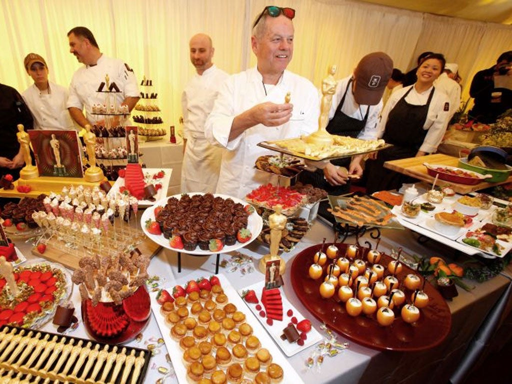 Winning ways: the chef Wolfgang Puck shows the foods on offer at the Oscars