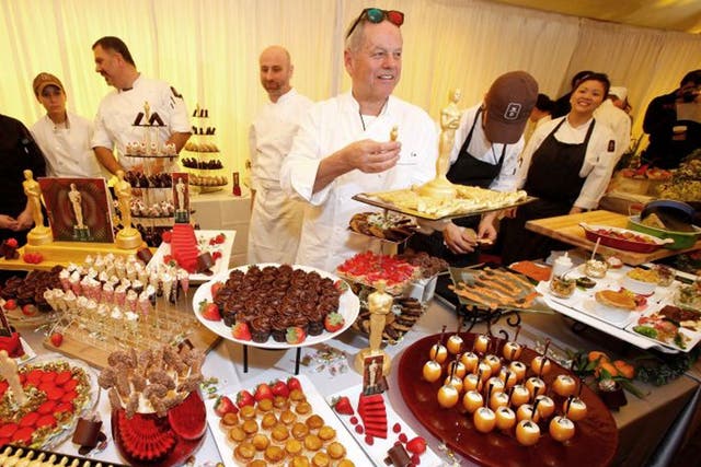 Winning ways: the chef Wolfgang Puck shows the foods on offer at the Oscars