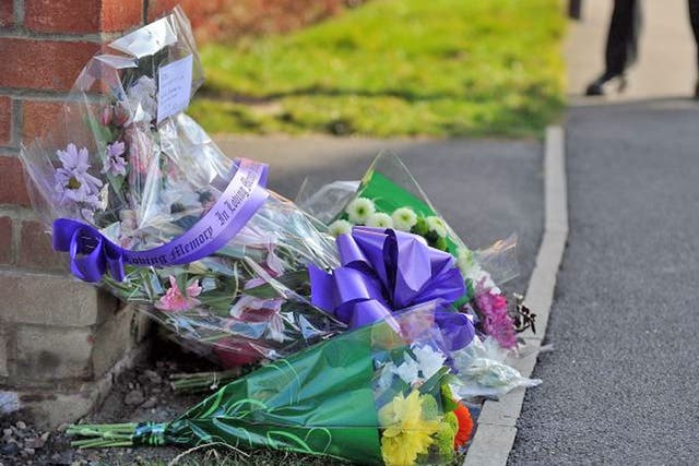 Floral tributes left outside the home of PC David Rathband yesterday