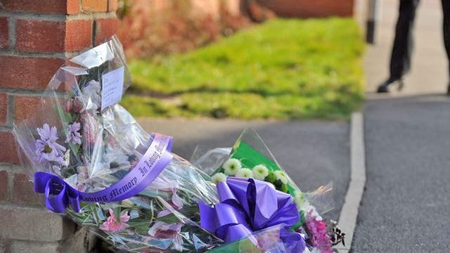 Floral tributes left outside the home of PC David Rathband yesterday